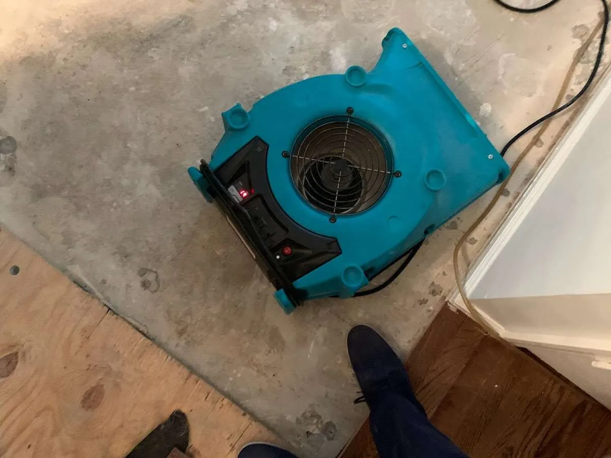 Air mover drying subfloor during Leak Detection & Repair in Dearborn